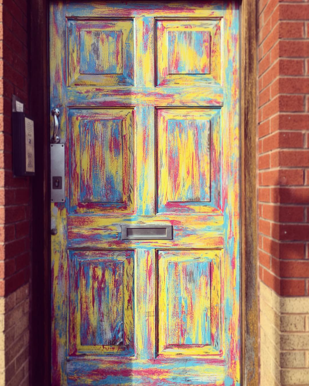 Colourful door of Redbrick House, Stokes Croft, Bristol